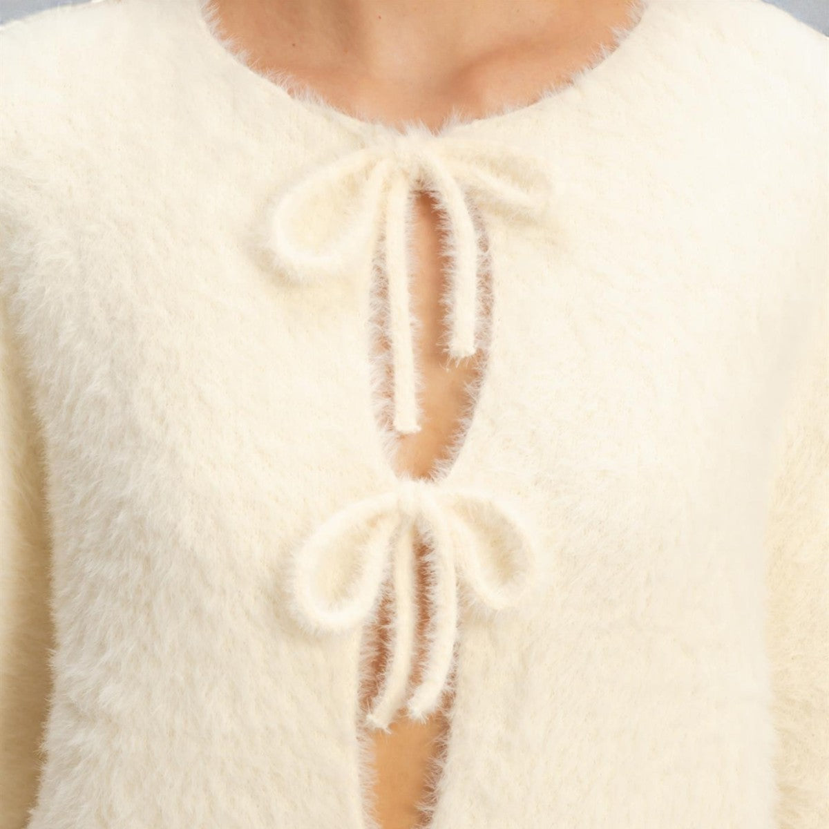 Sueter Hueso con Moños